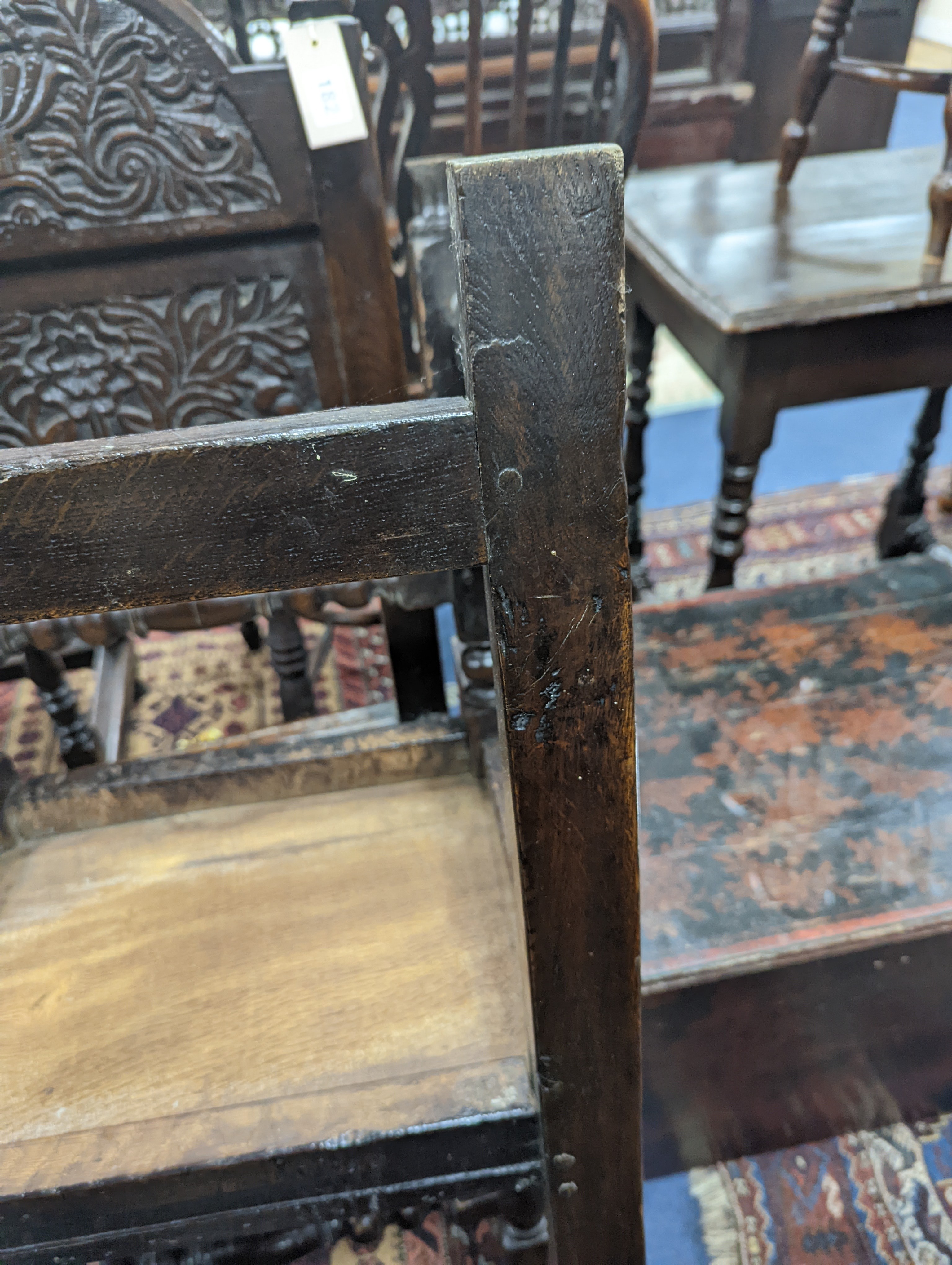 A pair of 17th century Lancashire carved oak side chairs, width 45cm, depth 39cm, height 101cm